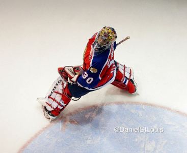 Moncton Wildcats goaltender watches a deflected puck go out of play.
