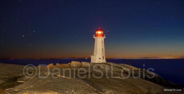 Lighthouse at night on Peggy's Cover, NS
